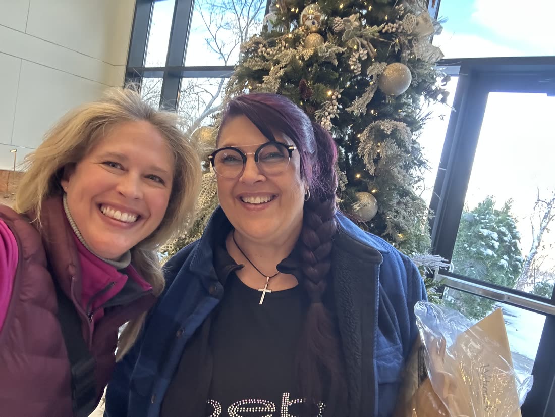 Andrea Scanlon smiling with a client on closing day